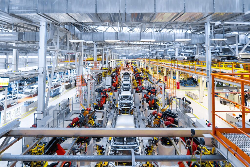 Automobile manufacturing plant producing vehicles for international export, import, and global automotive logistics services.